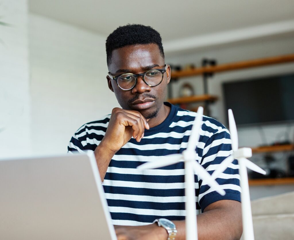 laptop computer black african american man home internet young office business student windmill